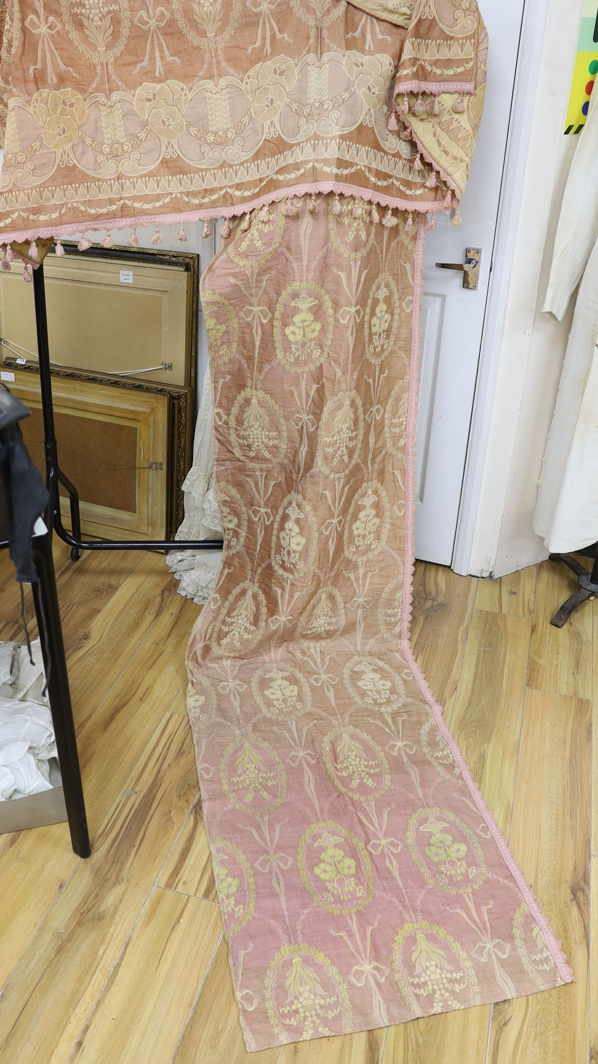 An unusual early 20th century hammock and pink brocade curtains